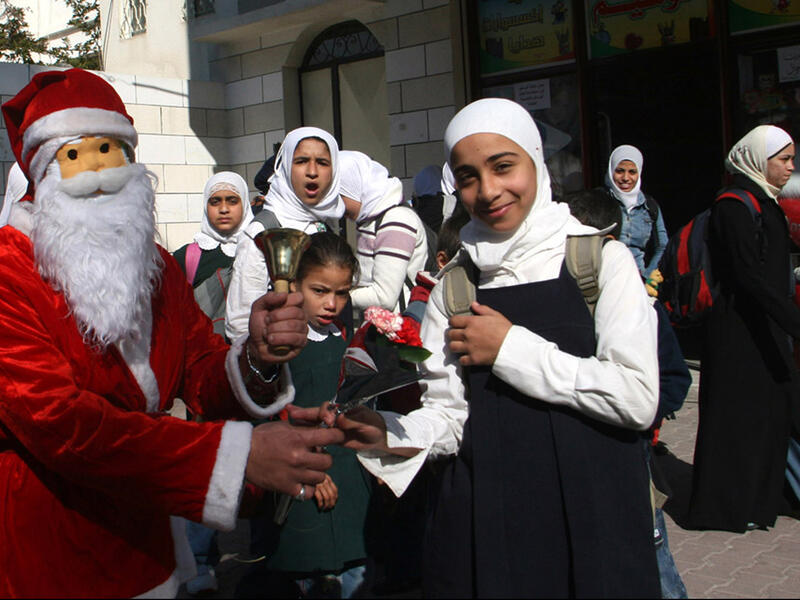 Santa Clauses hand out candy to children in the Old City, while Manger Square becomes a din of traditional musical performances and folkloric shows. The streets are abuzz with bands playing bagpipes -- a ritual that dates back to the days of the British Mandate (1920-1948), according to Anadolu Agency.