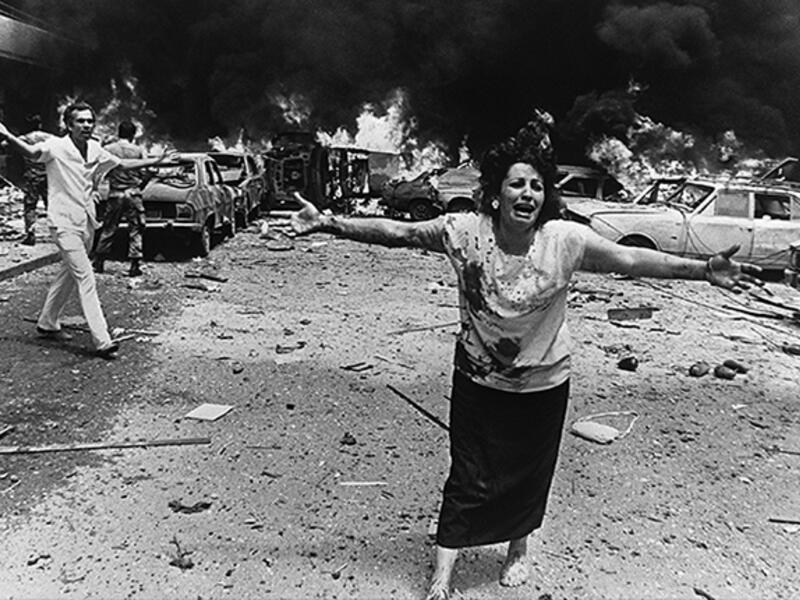 August 8, 1986,Tariq al-Jdideh, Lebanon - A woman screams out for her children after a bomb explosion during the 15-year-long Lebanese Civil War that killed some 170,000 people. This image illustrated the sheer chaos of the conflict, a reality the Lebanese are reminded of today by the bombed out buildings and bullet holes left behind.  