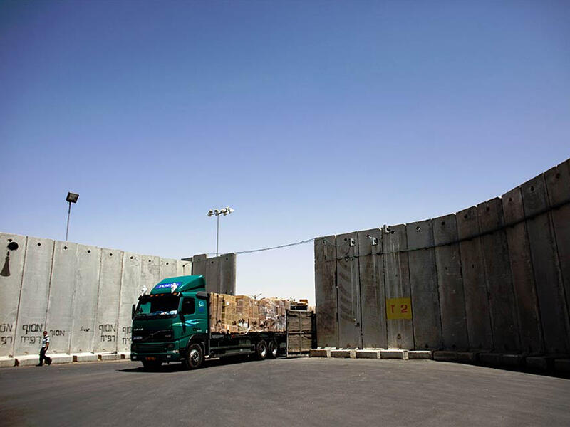 truck at israeli checkpoint barrier