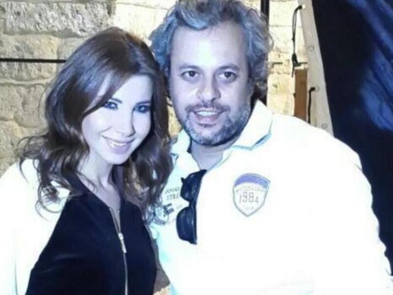 Behind the scenes of Nancy's new music video with her director. (Image: Twitter)