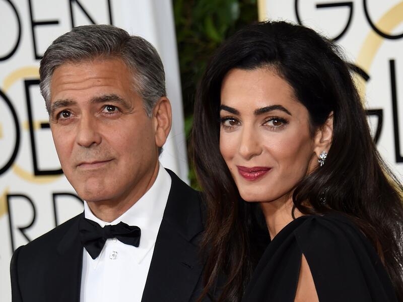 The Hollywood heart-throb set tongues wagging on gossip sites when he dined out in LA with a group of friends – but not wife Amal. (File photo)