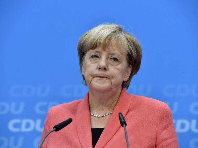 German chancellor Angela Merkel of the Christian Democratic Union (CDU) speaks during a press conference one day after regional election polls in Berlin on September 19, 2016. (AFP/John Macdougall)