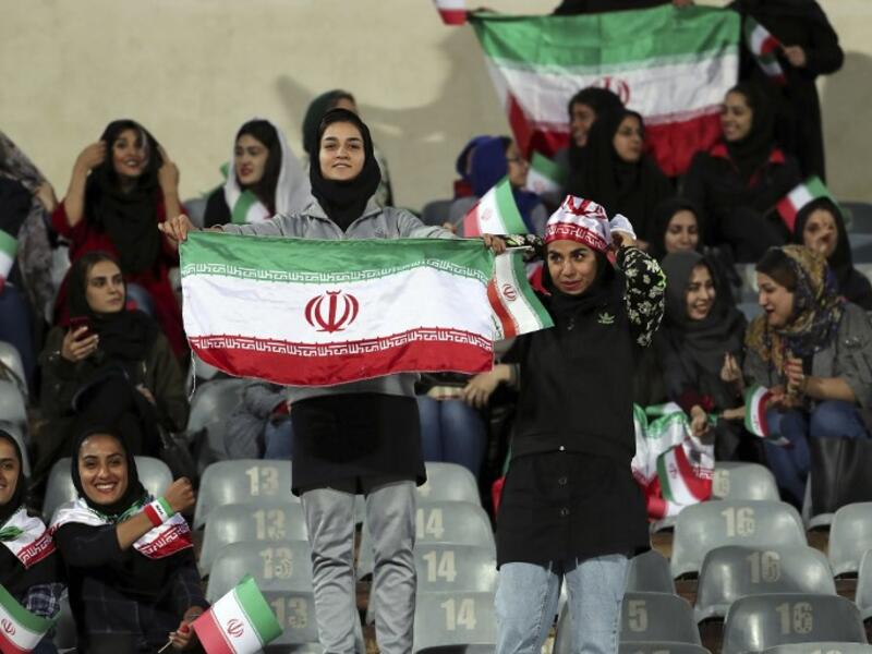 Iranian women cheer during the friendly football match between Iran and Bolivia at the Azadi Stadium in Tehran on October 16, 2018. (STR / AFP)
