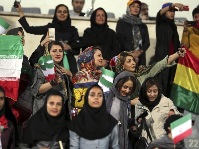 Iranian women take a selfie during the friendly football match between Iran and Bolivia at the Azadi Stadium in Tehran. (STR / AFP)