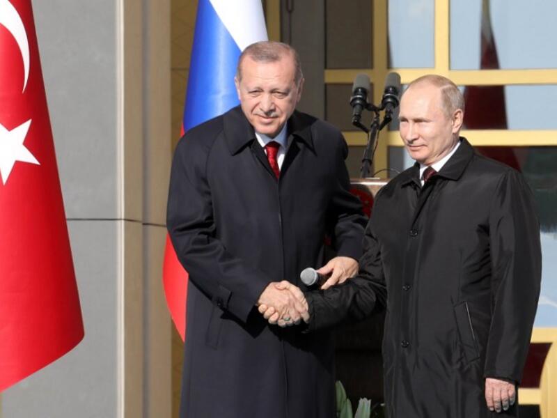Famous handshake to remember as both Erdogan and Putin cement a working nuclear relationship, 3 April, (ADEM ALTAN / AFP)