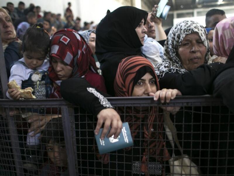 Palestinians wait at the Rafah border crossing with Egypt, in the southern Gaza Strip, after it was opened for two days by Egyptian authorities, on May 11, 2016. (AFP/Said Khatib)