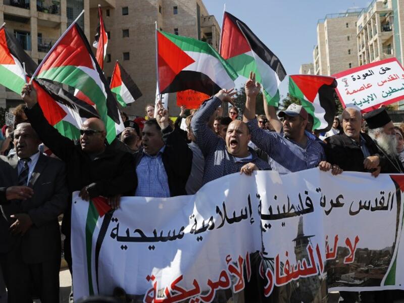 Arab demonstrators protest in front the new United States embassy in Jerusalem on May 14, 2018. The banner reads in Arabic " Jerusalem is Arab, Palestinian, Moslem, Christian". AHMAD GHARABLI / AFP