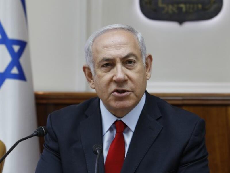 Israeli Prime Minister Benjamin Netanyahu opens the weekly cabinet meeting at his Occupied Jerusalem office on July 23, 2018. (GALI TIBBON / POOL / AFP)