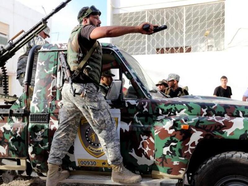 Libyan state security forces known as the "National Mobile Forces" patroling the street with the help of local rebels who know the Tripoli area, Novemeber 2012 (File photo: AFP)