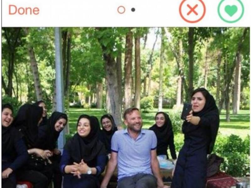 western man posing with hijabi women