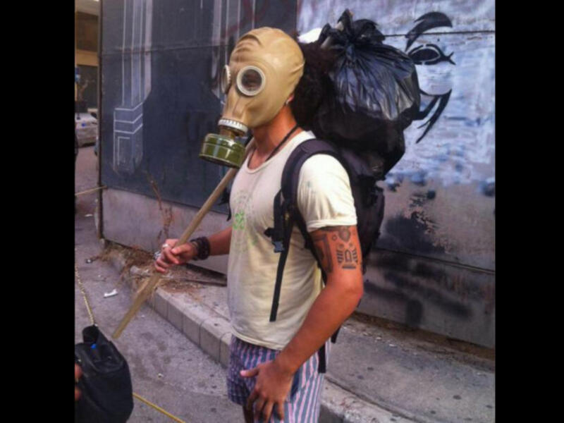 gas mask protester Lebanese trash