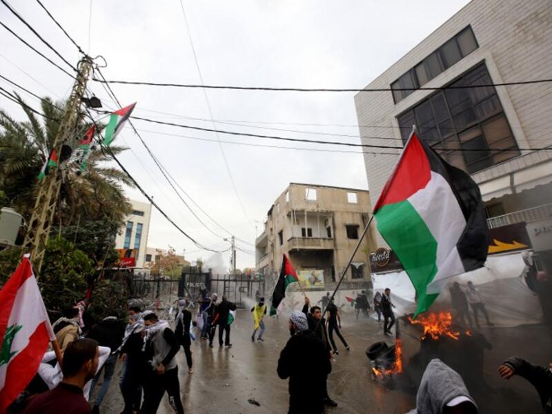 Protesters at  a demonstration outside the US embassy in Awkar on December 10, 2017 (Anwar Amro/AFP)