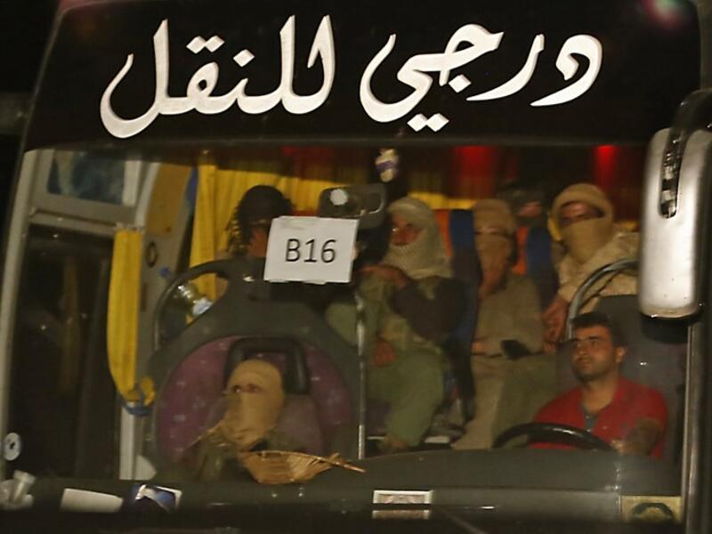 On Monday, 400 ISIS fighters began to be evacuated from the Lebanese border to eastern Syria, as part of an agreement with Lebanon, Hezbollah and Syria's government (AFP)

