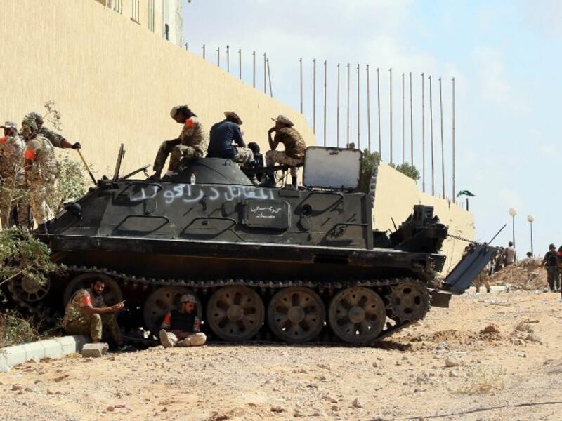 Forces loyal to Libya's Government of National Accord (GNA) hold a position in the area known as District Three in the west of the coastal city of Sirte on September 3, 2016 as they attack the last positions of Daesh in the city. (AFP/Mahmud Turkia)