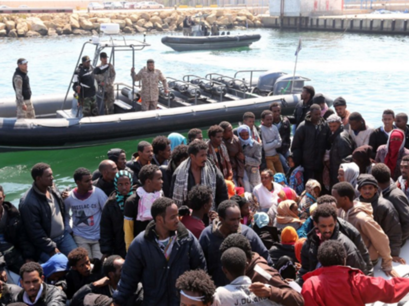 The Libyan coast guard organizes African migrants after rescuing them from a sinking boat. (AFP/File)