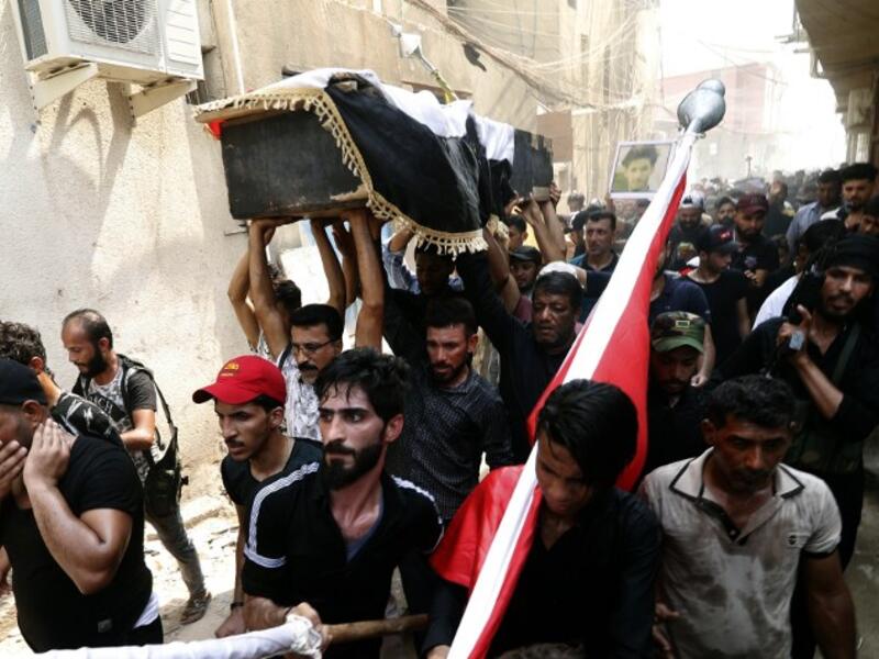 Iraqi protestors carry the coffin of a man on September 4, 2018, that family and Human rights activists claim was killed by bullet shots during the previous day, while demonstrating against the government and the lack of basic services, in the southern city of Basra.
Haidar MOHAMMED ALI / AFP