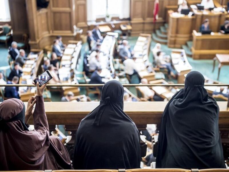 Women wearing burqa sit in the audience at the Danish Parliament in Copenhagen, Denmark, in May 2018. (AFP/File Photo)