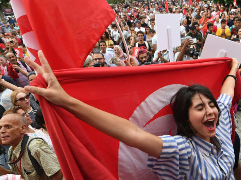 An image was taken from protests in Tunisia for women celebrating the president's proposal for an amended inheritance law that grants women equal rights with men. (AFP)