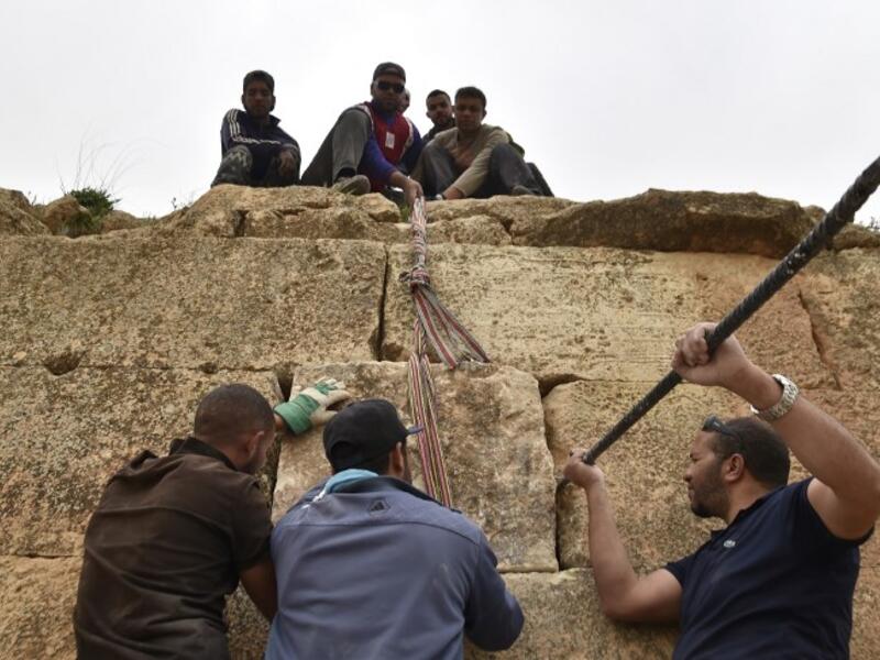 Experts and students from Algiers University’s Archaeology Institute work on one of the Jeddars pyramid tombs, near the city of Tiaret.
RYAD KRAMDI / AFP