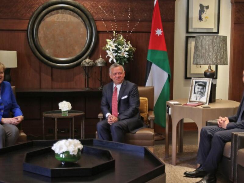 Jordanian King Abdullah II, Crown Prince Hussein bin Abdullah welcome German Chancellor Angela Merkel at the Jordan Royal Palace in Amman, June 21, 2018. (AFP/Khalil Mazraawi)