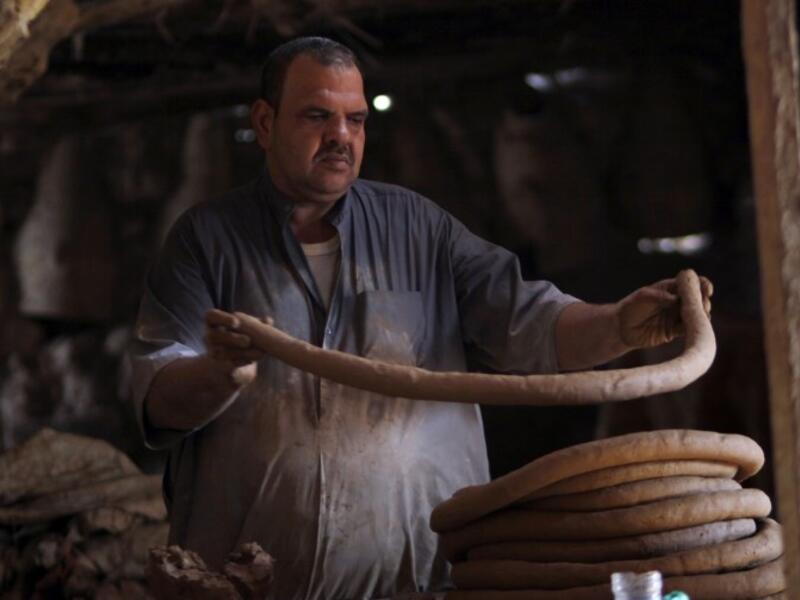 Iraqis making clay pots in Najaf on November 11, 2018. Pottery has deep roots in Iraq, where ancient civilisations turned to clay to build their homes, shape their cooking utensils, and even make their ovens.
Haidar HAMDANI / AFP