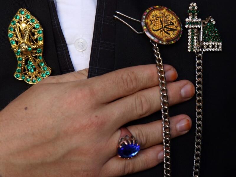 Religious symbols adorning the jacket of an Iraqi Sufi Muslim Kurd are pictured during a ritual ceremony to commemorate the birth of the Prophet Mohammed in the Kurdish town of Akra.
SAFIN HAMED / AFP