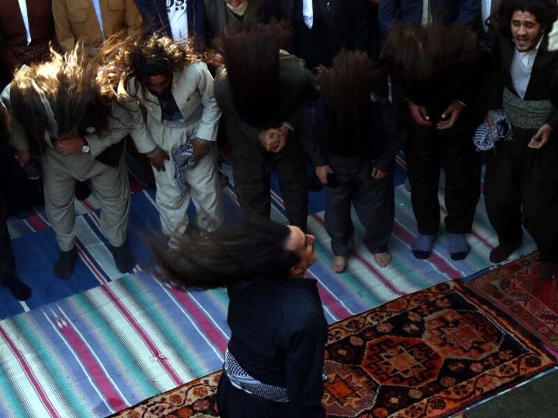 Iraqi Sufi Muslim Kurds take part in a ritual ceremony to commemorate the birth of the Prophet Mohammed.
SAFIN HAMED / AFP