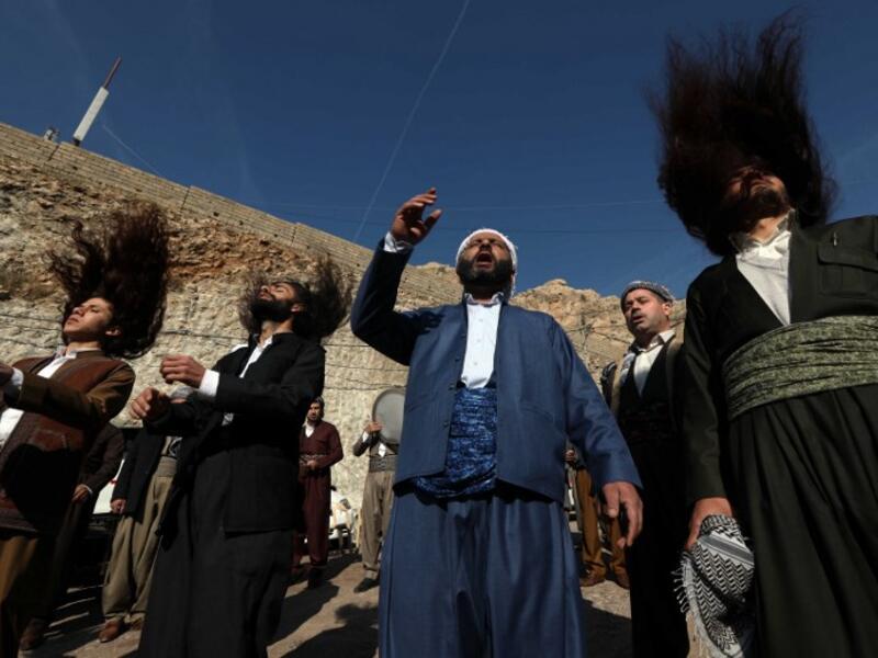 Iraqi Sufi Muslim Kurds take part in a ritual ceremony to commemorate the birth of the Prophet Mohammed in the Kurdish town of Akra, 500 km north of Baghdad, on November 19, 2018.
SAFIN HAMED / AFP