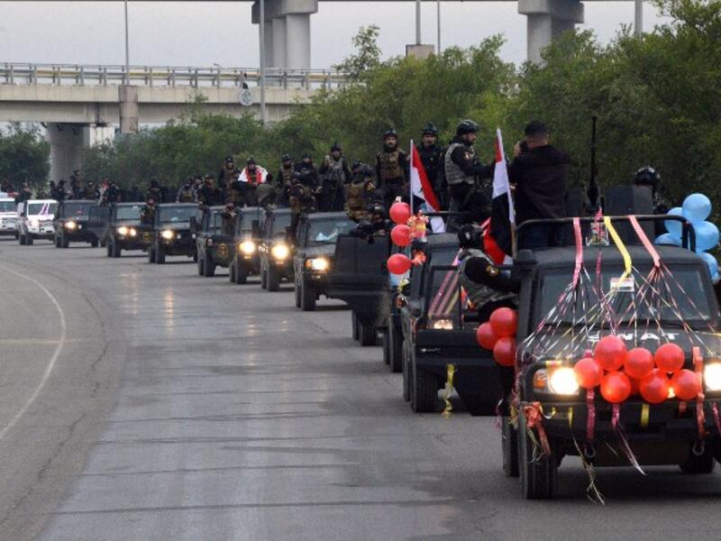Members of the Iraqi security forces parade in the streets of the Iraqi city of Mosul.
Zaid AL-OBEIDI / AFP