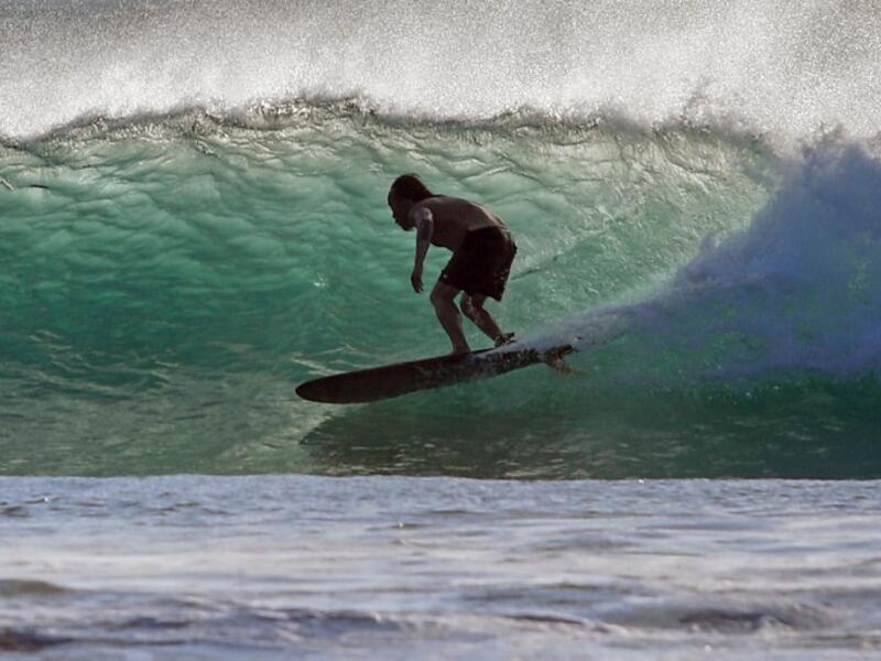 A surfer enjoys the waves at Las Baulas National Marine Park, Playa Grande, Costa Rica on December 10, 2018. David GANNON / AFP