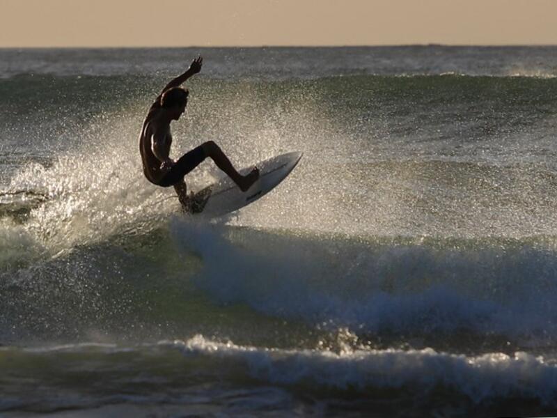 A surfer enjoys the waves at Las Baulas National Marine Park, Playa Grande, Costa Rica on December 10, 2018. David GANNON / AFP