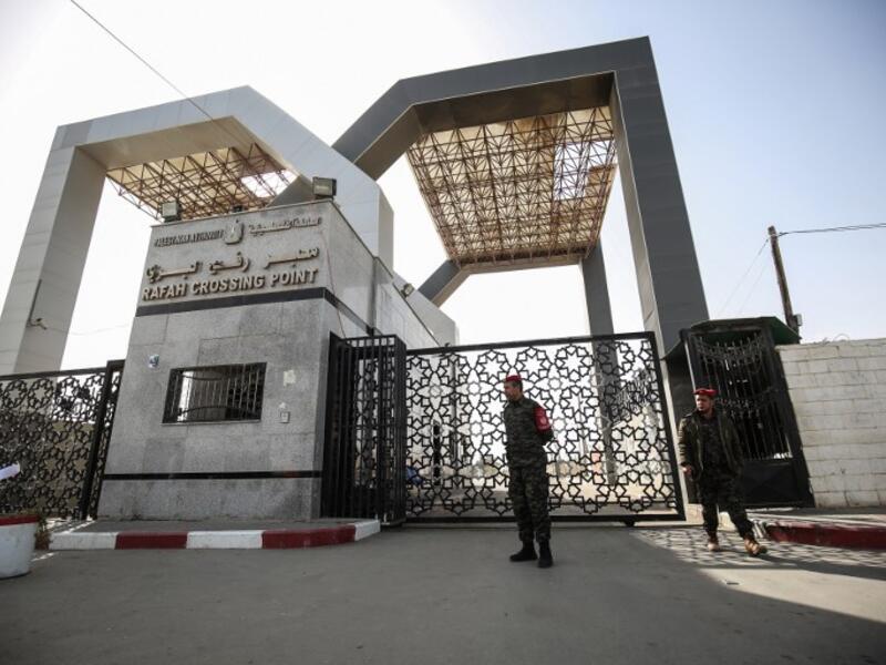 Palestinian security forces loyal to Hamas stand at the Rafah crossing point between Egypt and the southern Gaza Strip on January 24, 2019 in Rafah. 
SAID KHATIB / AFP
