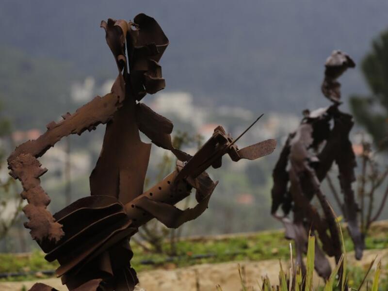 In a celebration of tradition and memory, artist Charles Nassar has been transforming the dark, wrangled remains into sculptures. "I hate shrapnel, but I also love it at the same time," said the 54-year-old sculptor with a neat salt-and-pepper beard, from a garden south of Beirut.
JOSEPH EID / AFP