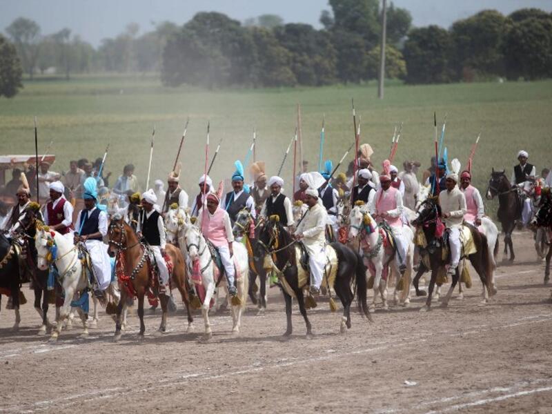This photograph taken on March 27, 2019, shows Pakistani horse riders during an attempt for a Guinness World Record for tent pegging in Khanewal district in Punjab province.
SS MIRZA / AFP
