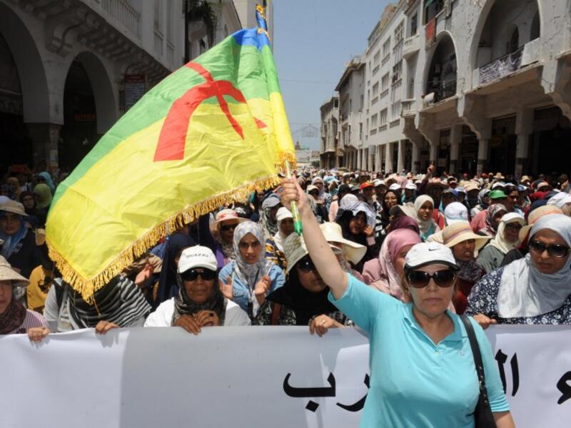 A Moroccan protester waves a flag of the Amazigh, Morocco's Berber community, during a demonstration in downtown Rabat on June 11, 2017, demanding that authorities release the leaders of a protest movement that has rocked the neglected northern Rif region for months. (Stringer/AFP)