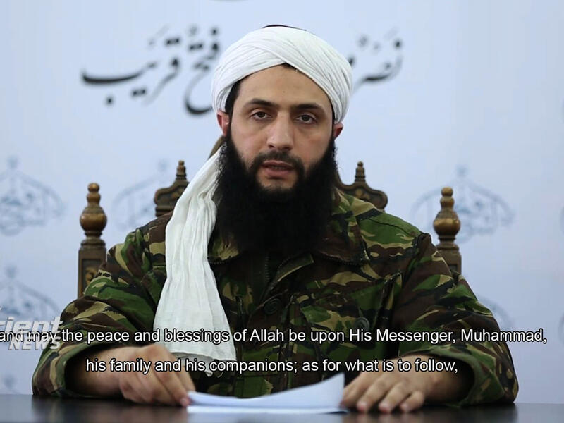 An image grab taken from a video broadcast Thursday by Dubai-based Orient News satellite television shows the head of Nusra Front in Syria, Abu Mohamad al-Jolani, giving a speech from an undisclosed location, in the first-ever video showing his face to be released. Jolani said his group was breaking ties with al-Qaida and changing its Arabic name to Jabhat Fateh al-Sham (Conquest of Syria). (Courtesy photo)