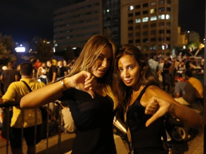 Lebanese protesters gesture during a demonstration organized by the "You Stink" campaign against the ongoing trash crisis in the capital Beirut on 22 August. (AFP/File)