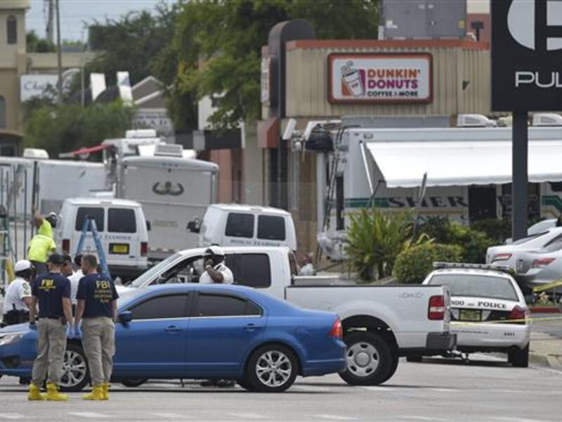 Police at the scene of the massacre in the day after the deaths (AFP / File)