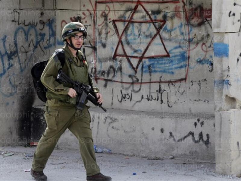 An Israeli soldier on patrol in the southern West Bank city of Hebron. (AFP/File)