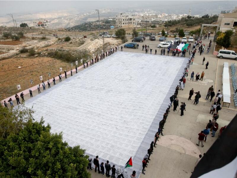 Arial photo of largest Keffiyeh with a size of one thousand four hundred Meter square in dura, near the West Bank town of Hebron, on November 14. (HAZEM BADER / AFP)