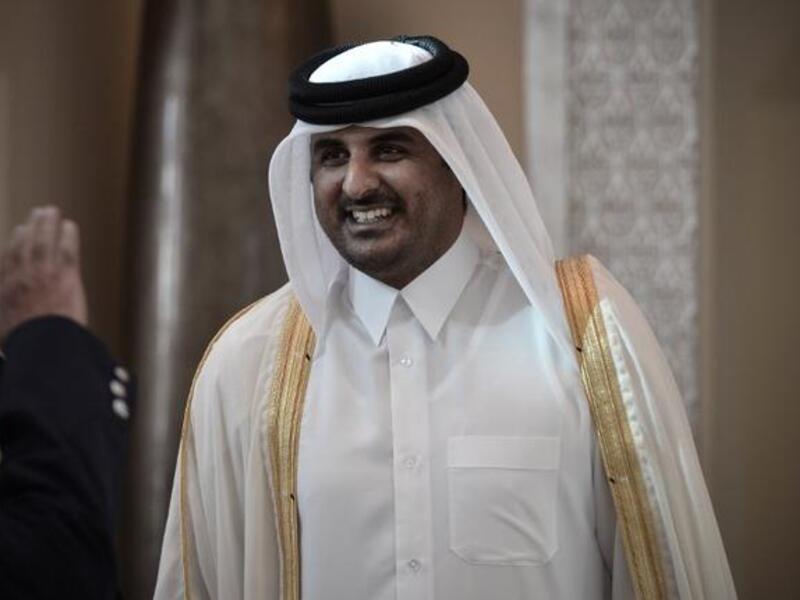 Former Qatari Crown Prince Sheikh Tamim bin Hamad al-Thani smiling as he arrives in the Bahraini capital of Manama, to attend the annual Gulf Cooperation Council (GCC) summit (Mohammed Al-Shaikh / AFP)