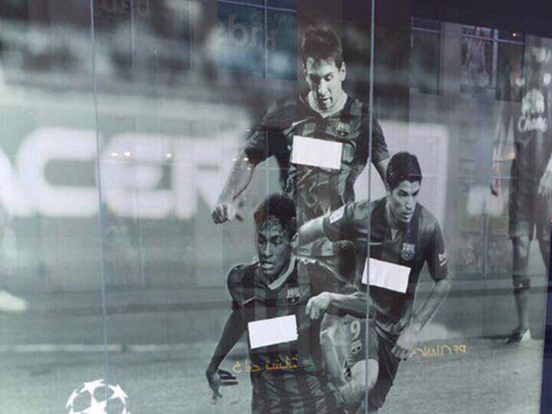 A photo from a UAE mall appears to show an advertisement for Barcelona football club censored, with the Qatar Airways sponsor covered. (Twitter/ Raed Al-Emadi)