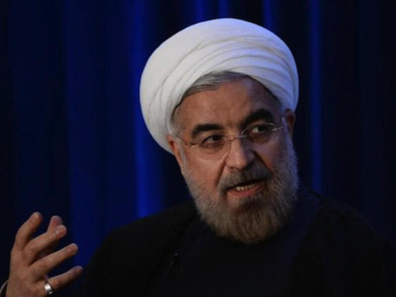Back at home, Iranian President Hassan Rouhani is facing pressure from hard-liners not to release too much to reach a deal, and to deliver on a promise to lift sanctions. (AFP/File)