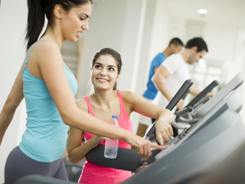women working out treadmill