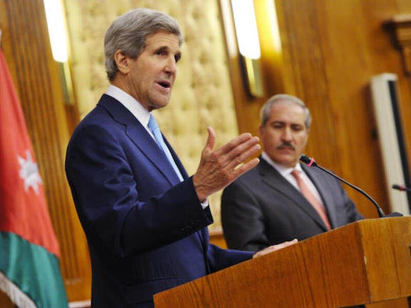 US Secretary of State John Kerry speaks during a joint press conference in Amman as Jordan's Foreign Minister Nasser Judehlooks on (Source: AFP PHOTO/Mandel NGAN-POOL)