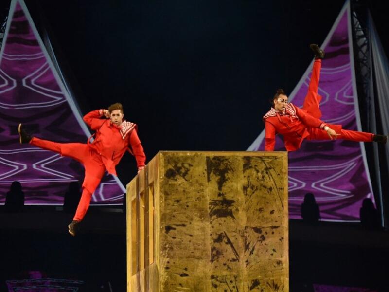 Members of the Canadian circus troop Le Cirque du Soleil perform a show as a part of celebrations of the 88th Saudi National Day at the King Fahad stadium on September 23, 2018 in Riyadh. (FAYEZ NURELDINE / AFP)