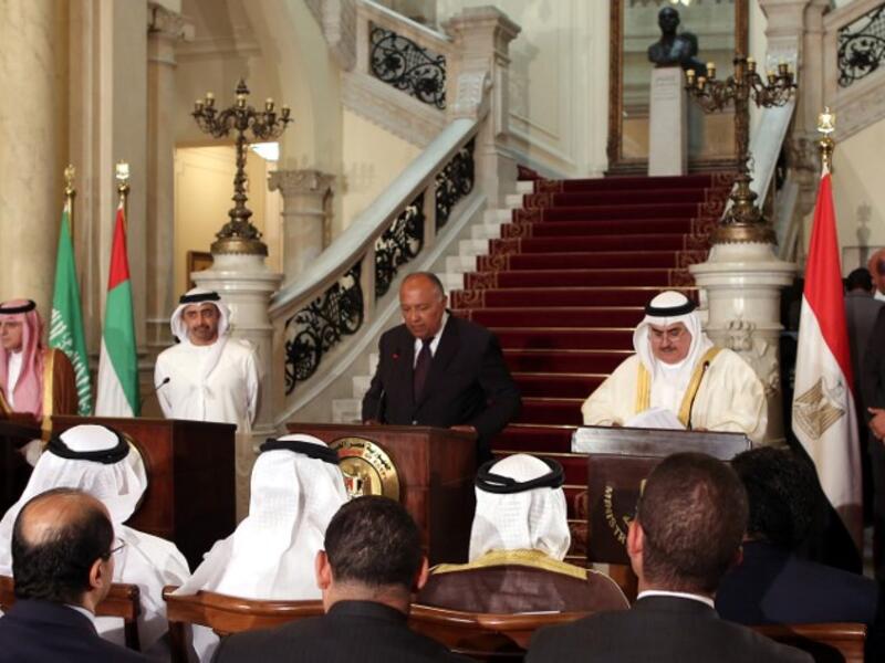 Egyptian Foreign Minister Sameh Shoukry (C) reads a statement while giving a joint press conference with his Saudi, Emirati and Bahraini counterparts on July 5 2017 (Khaled Elfiqi/Pool/AFP)