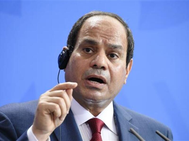 Egyptian president Abdel Fattah al-Sisi speaking at a conference (AFP/File)