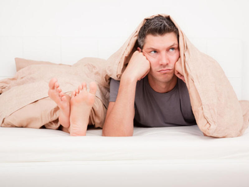 man and woman bed sheets