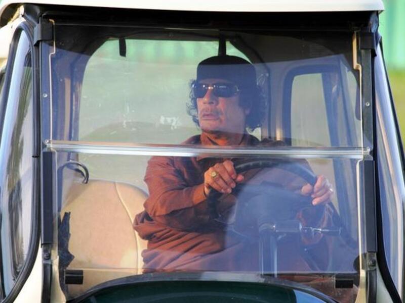 Gaddafi on the run, behind his 'shades'. His family fled to neighboring Algeria, welcomed as refugees,
according to desert nomadic tradition. Gaddafi's daughter, Aisha, gave birth to a girl on the Algerian borders. As for 
the current most wanted grandfather, he is playing Cat & Mouse with the NTC which is trying to cement its grip on Libya. 